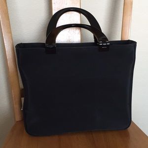 Prada handbag. Black fabric/plastic handles